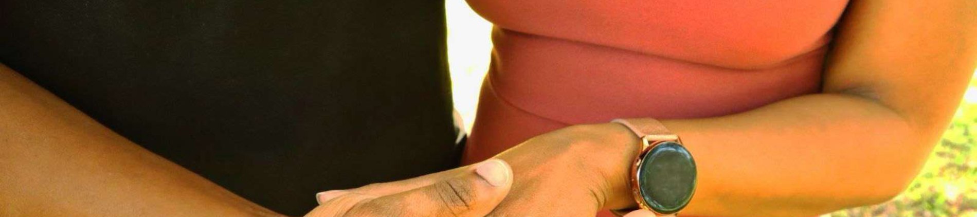 Samuel and Oneisha holding hands, her engagement ring in view