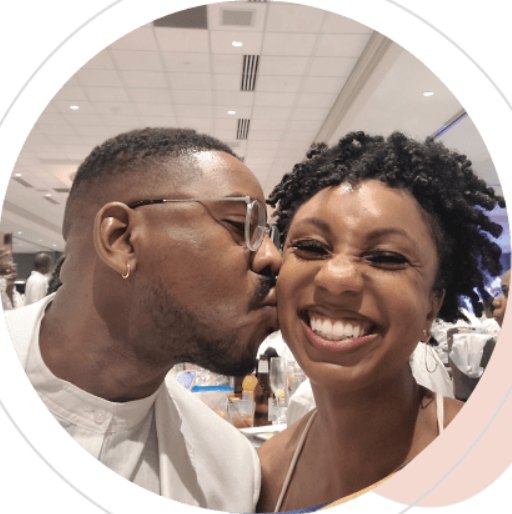 Samuel kissing Oneisha on the cheek as she smiles